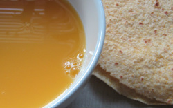 Pumkin soup in a bowl with flat bread